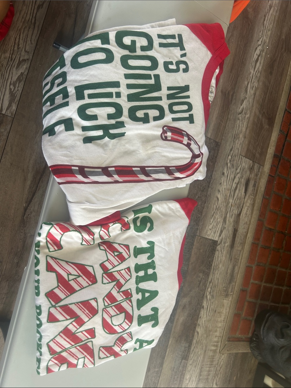 A set of White & Red Long Sleeve Graphic Tee - Holiday Candy Cane Print